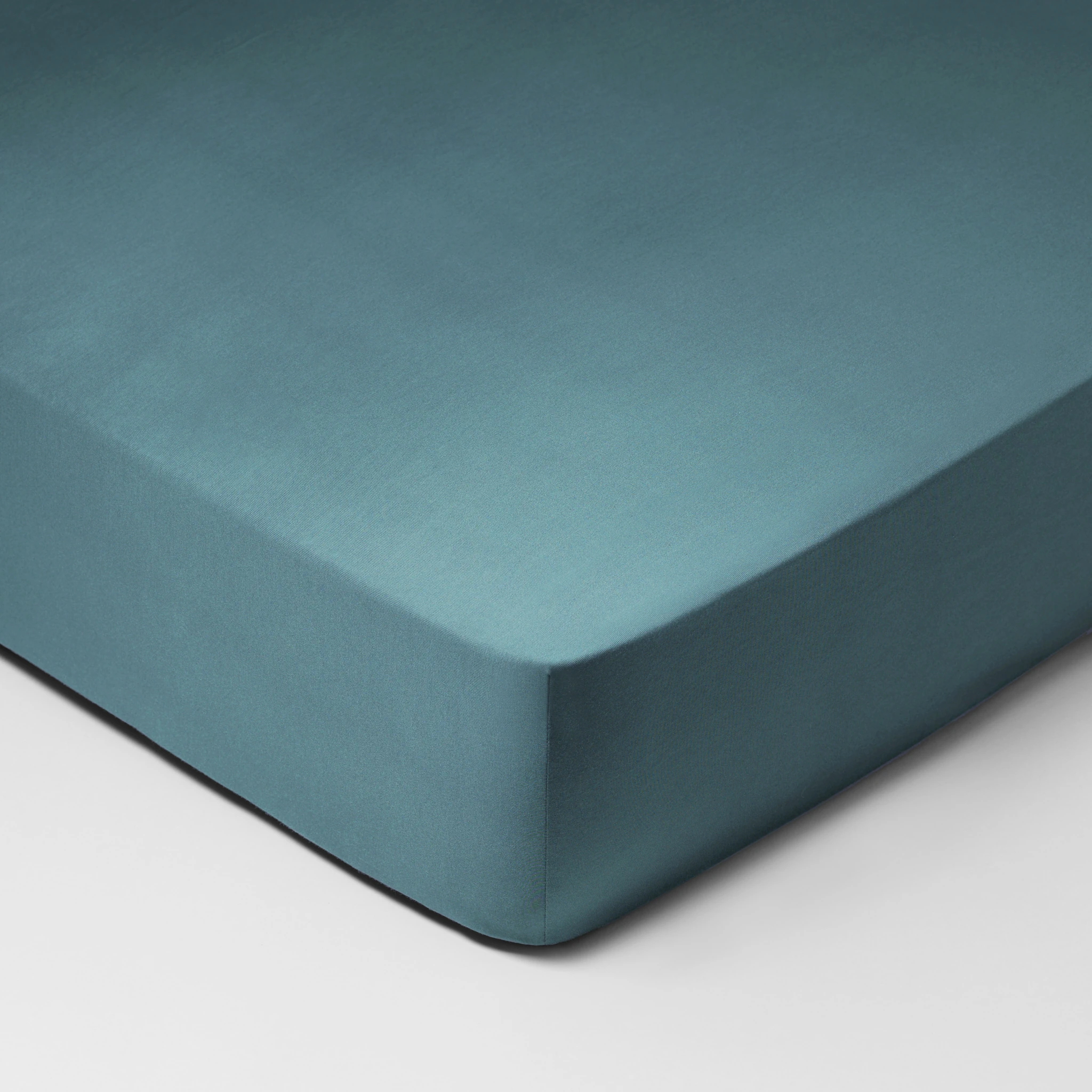 Schlossberg Spannbettlaken MULTI FIX Jersey Petrol Produkt Schlossberg Spannbettlaken MULTI FIX Jersey Petrol
